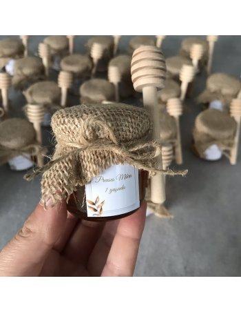 Petit pot de miel avec cuillère en bois