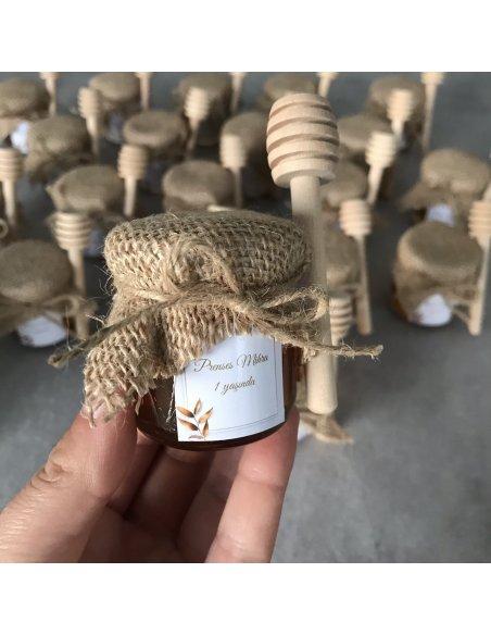 Petit pot de miel avec cuillère en bois