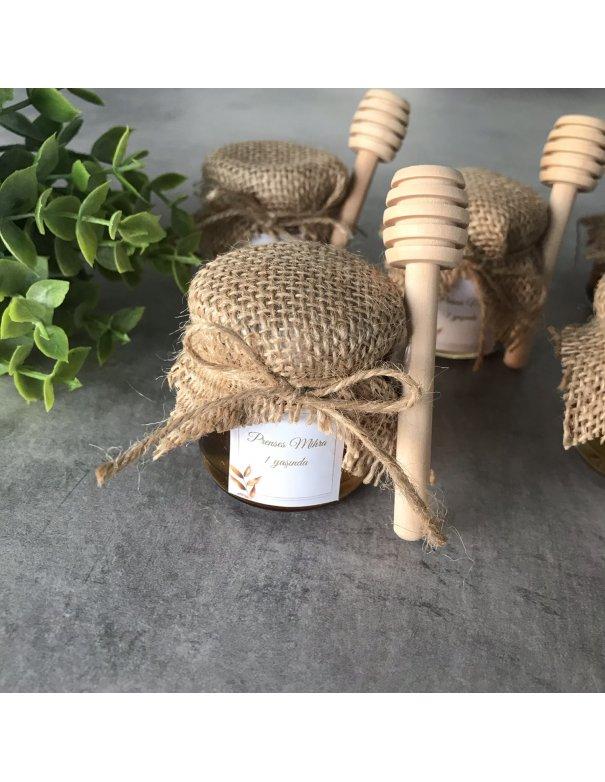 Petit pot de miel avec cuillère en bois