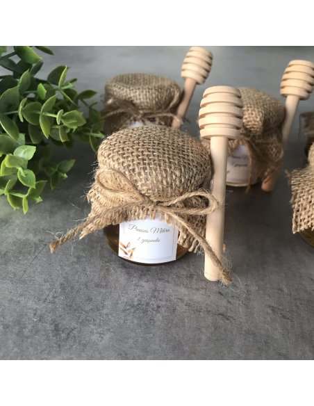 Petit pot de miel avec cuillère en bois