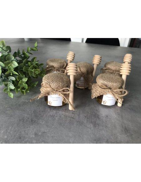 Petit pot de miel avec cuillère en bois