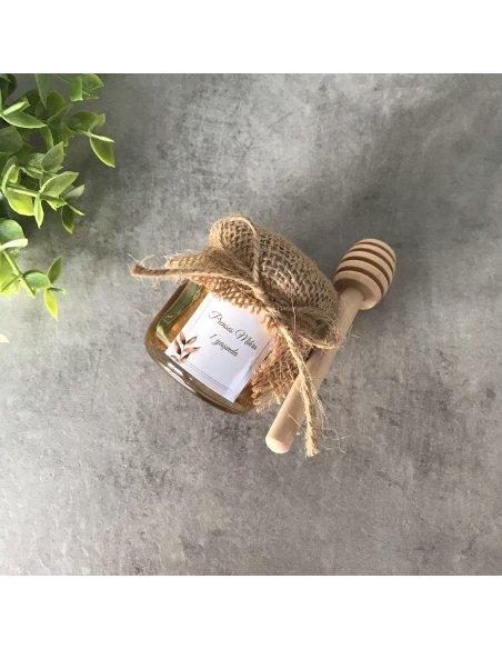 Petit pot de miel avec cuillère en bois