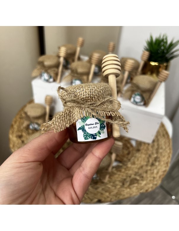 Petit pot de miel avec cuillère en bois