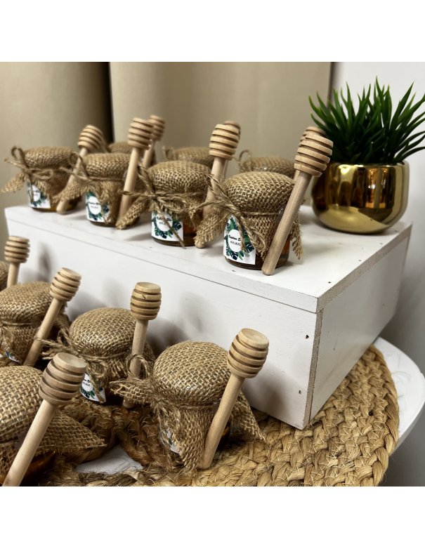 Petit pot de miel avec cuillère en bois
