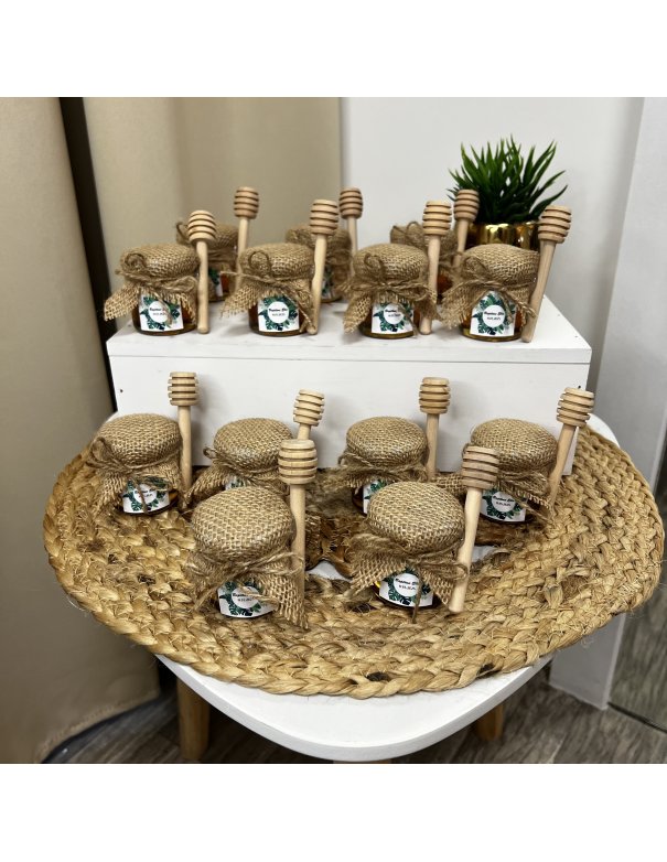 Petit pot de miel avec cuillère en bois