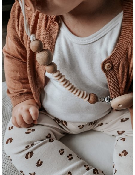 Attache tétine lentille